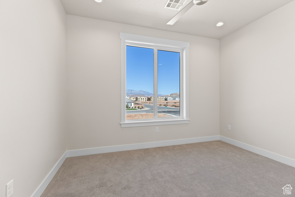 Unfurnished room with light carpet