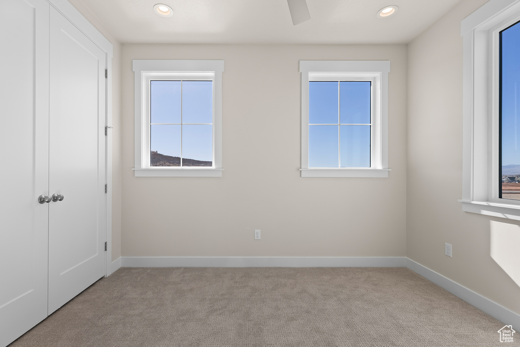 Unfurnished room with light carpet