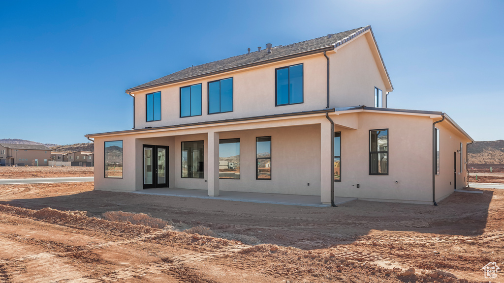 Rear view of property featuring a patio