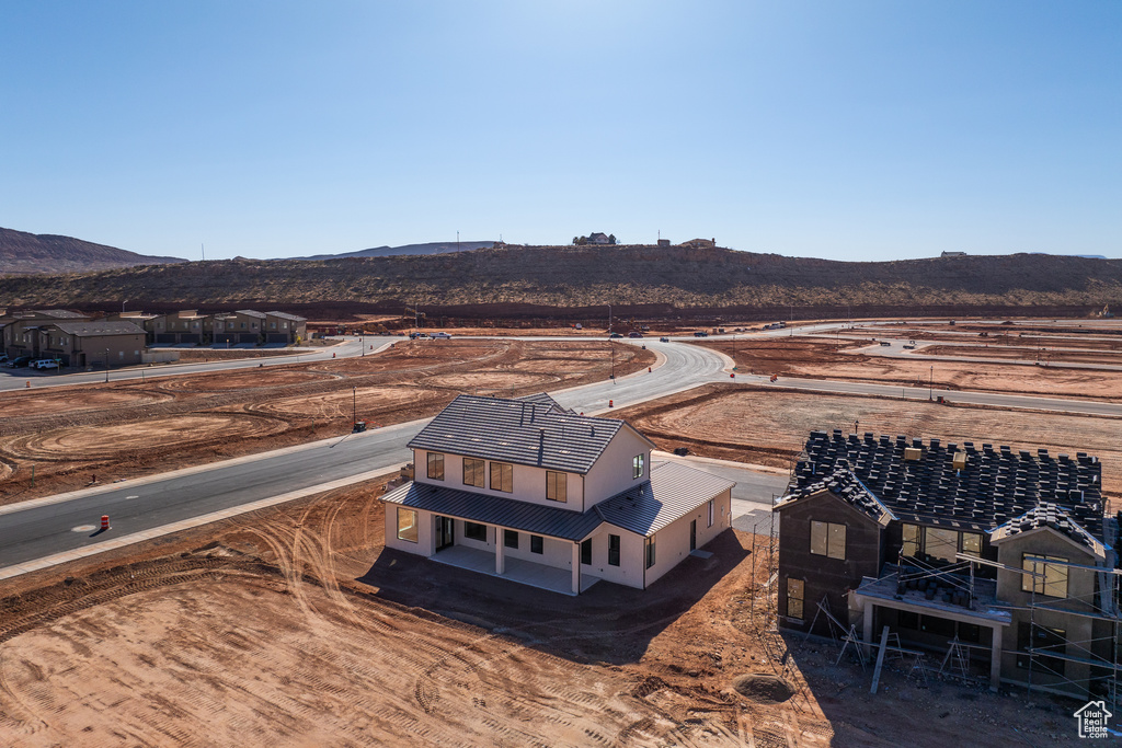 Birds eye view of property with a mountain view