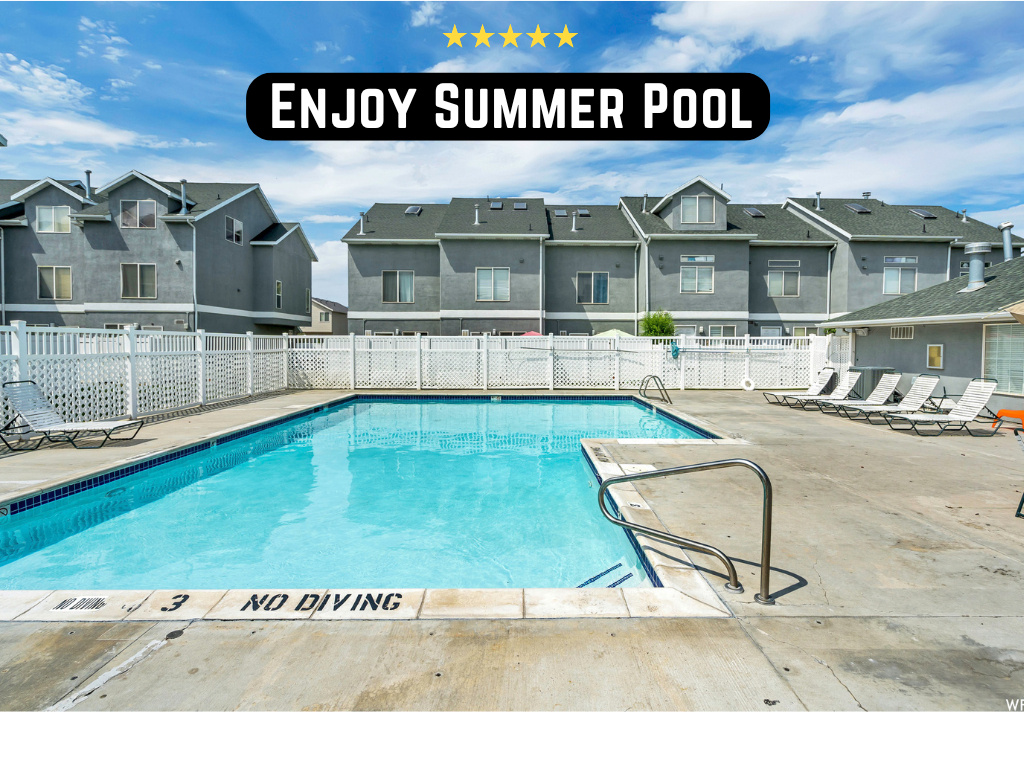 Community pool with a residential view and a patio