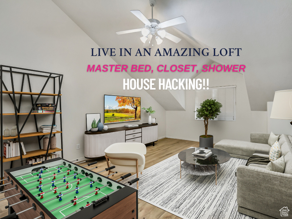 Rec room featuring wood finished floors, ceiling fan, and lofted ceiling
