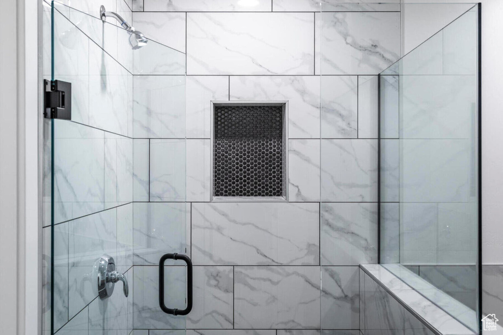 Bathroom with a shower with door