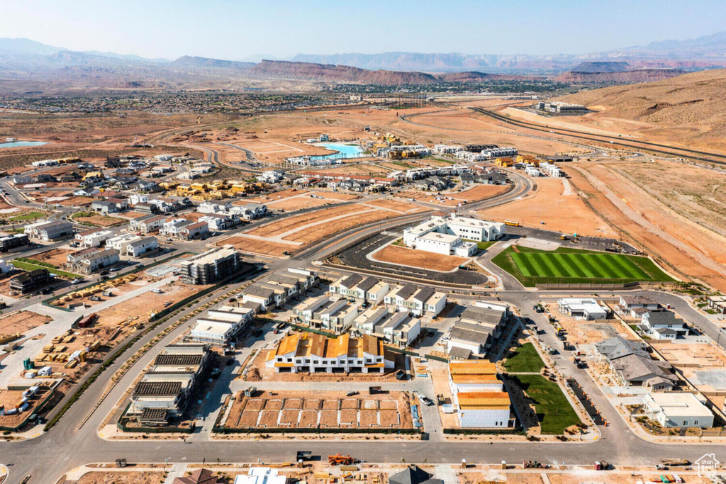 Birds eye view of property with a mountain view