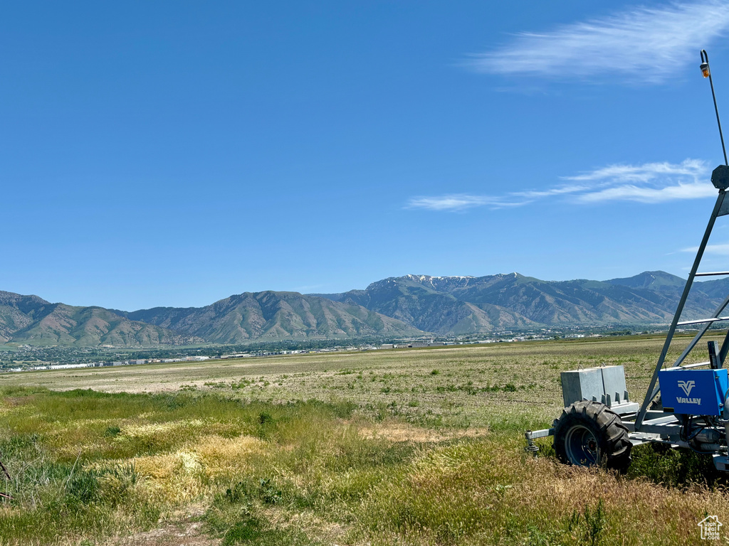 View of mountain backdrop with rural landscape