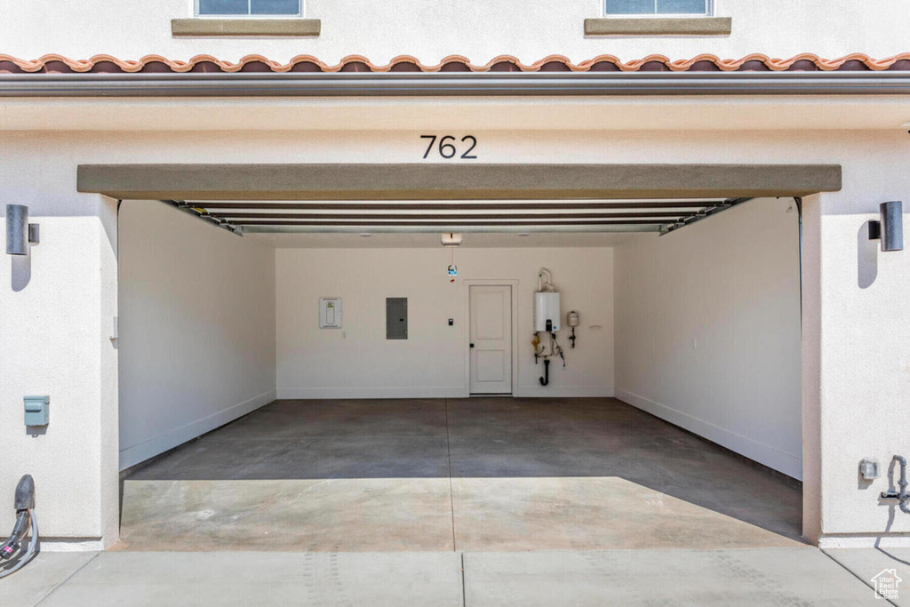 Garage with electric panel and water heater