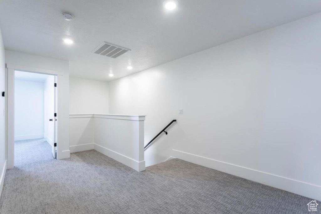 Unfurnished room with light colored carpet