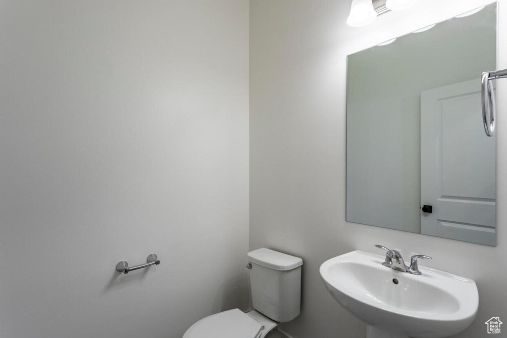 Bathroom featuring sink and toilet