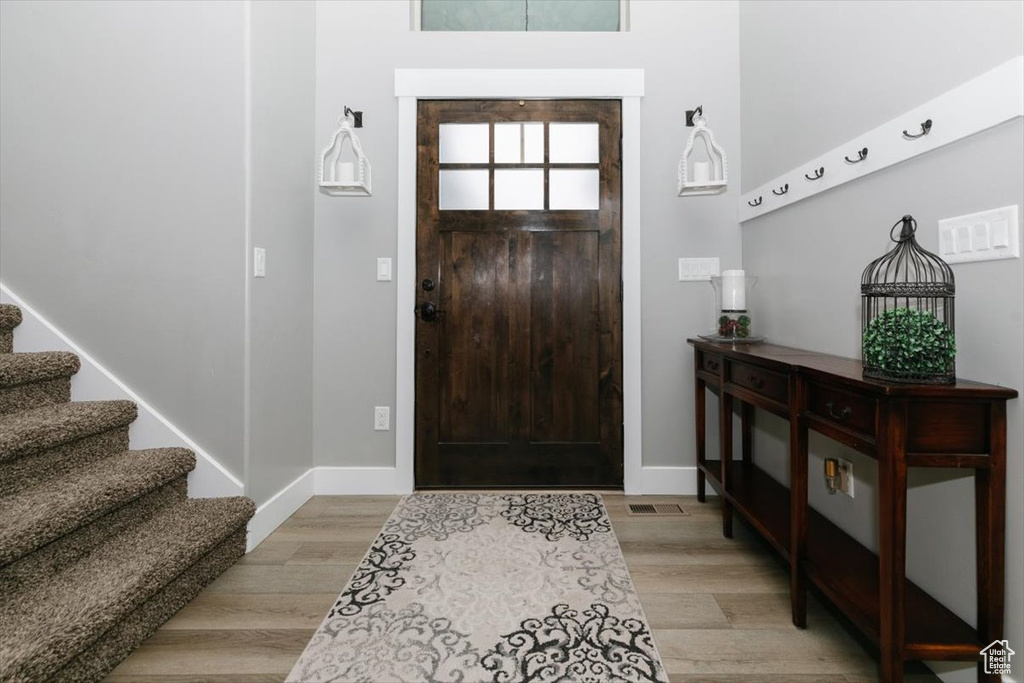 Entrance foyer featuring light wood-type flooring