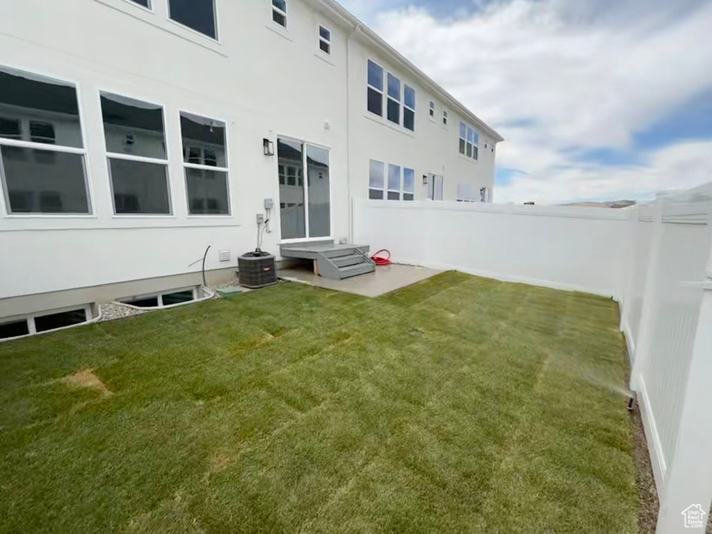 Fenced backyard with entry steps