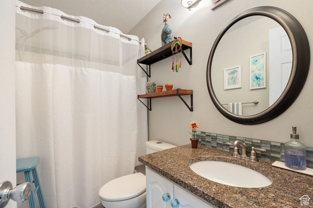 Bathroom with vanity and toilet