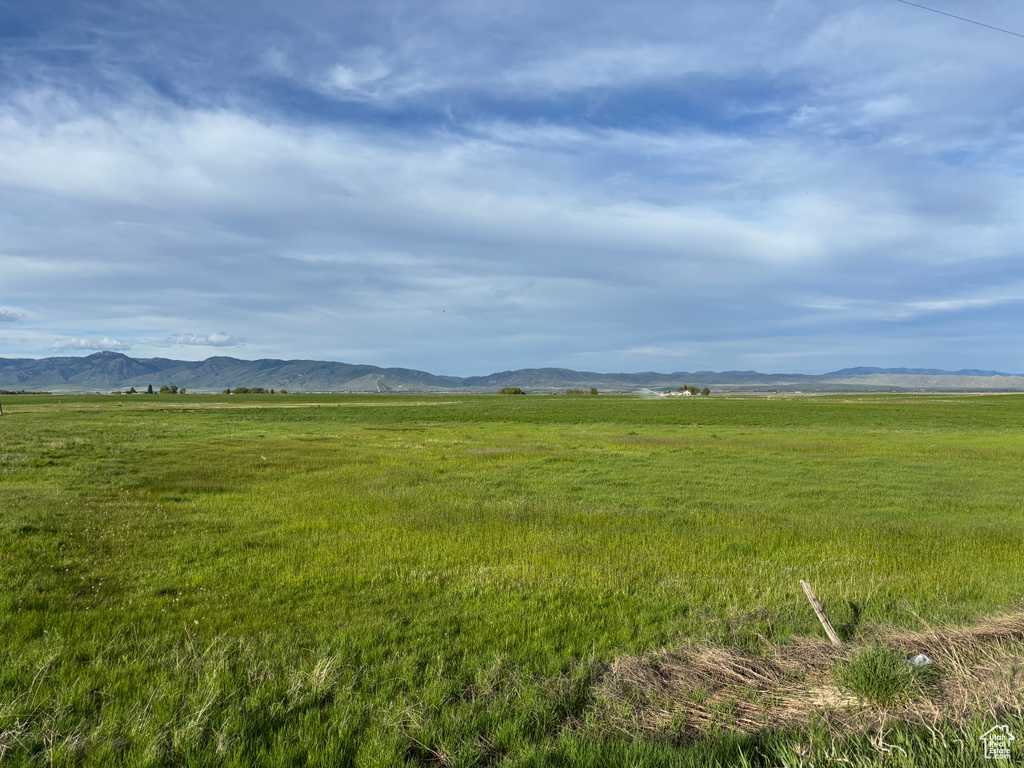 View of mountain background featuring rural landscape