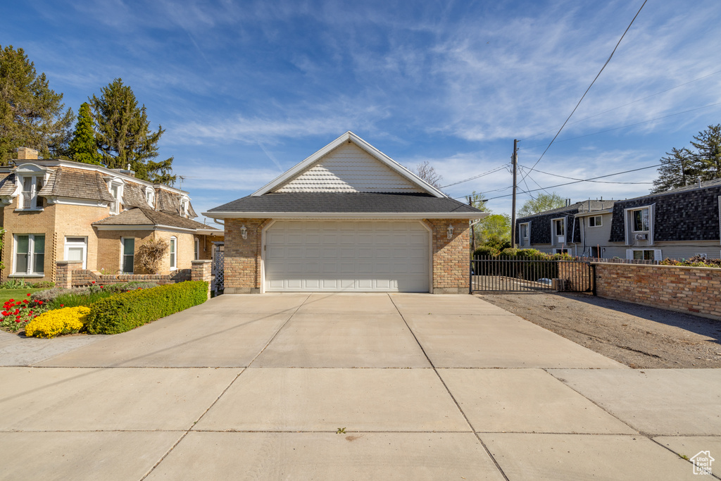 View of front facade featuring a garage