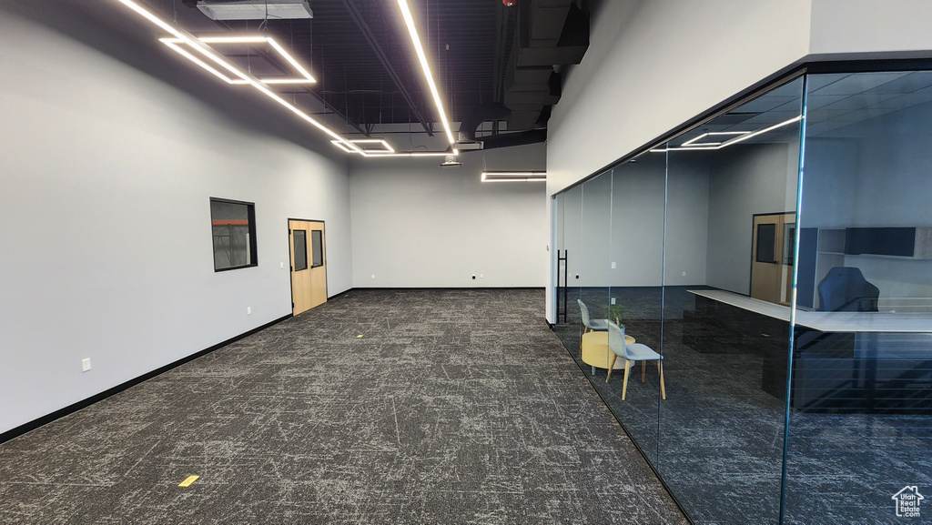 Basement featuring dark carpet