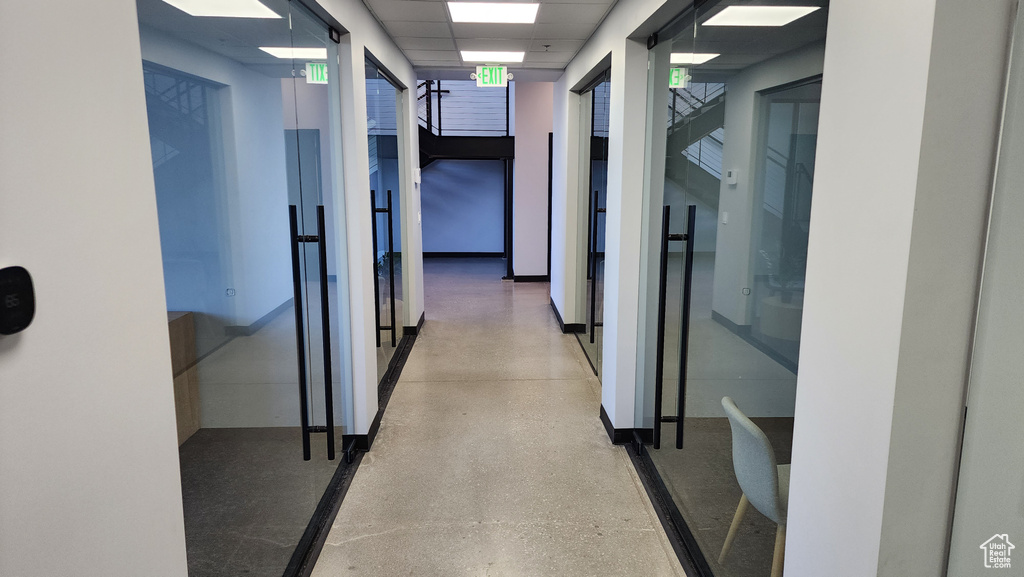 Corridor featuring a drop ceiling