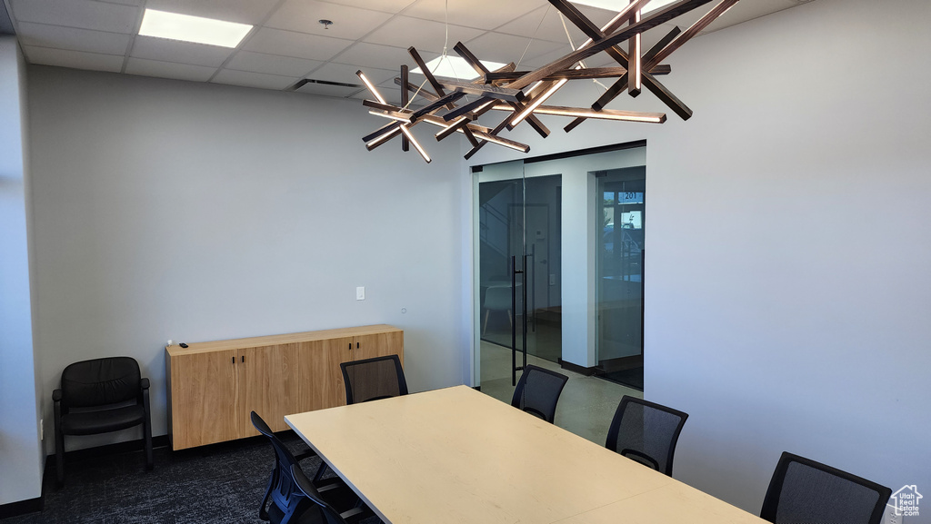 Dining area featuring a drop ceiling