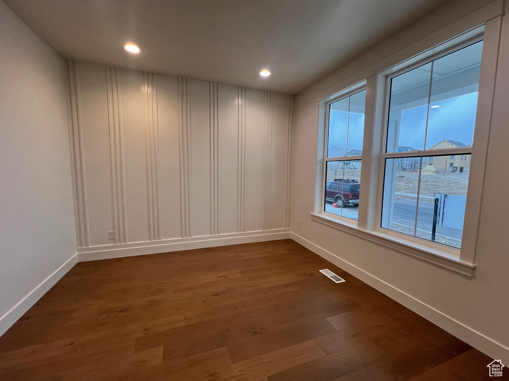 Spare room with hardwood / wood-style floors