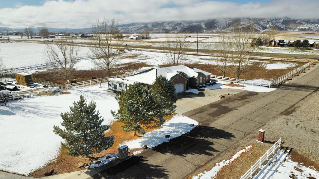 Snowy aerial view with a rural view