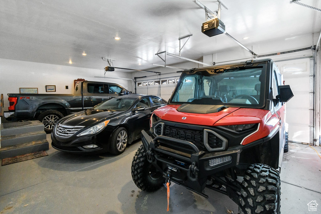 Garage featuring a garage door opener