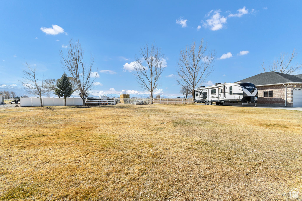 View of yard with a garage