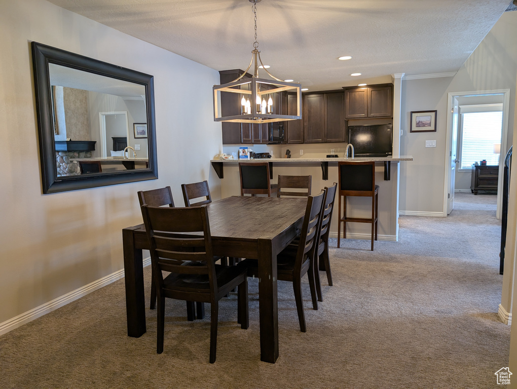 Dining space with light colored carpet