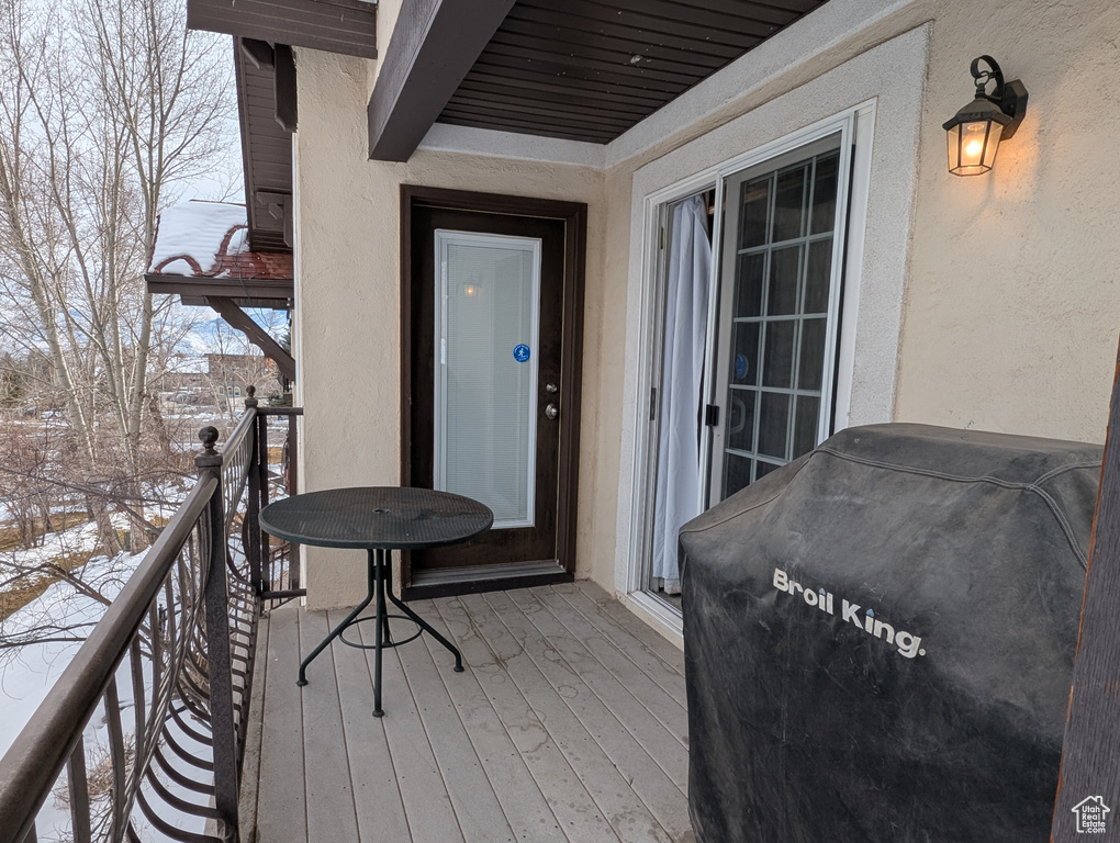 Snow covered deck with grilling area