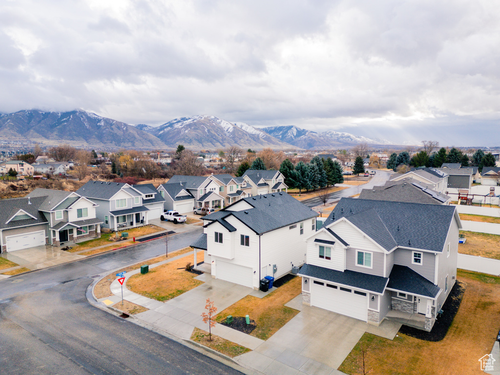 Birds eye view of property with a mountain view