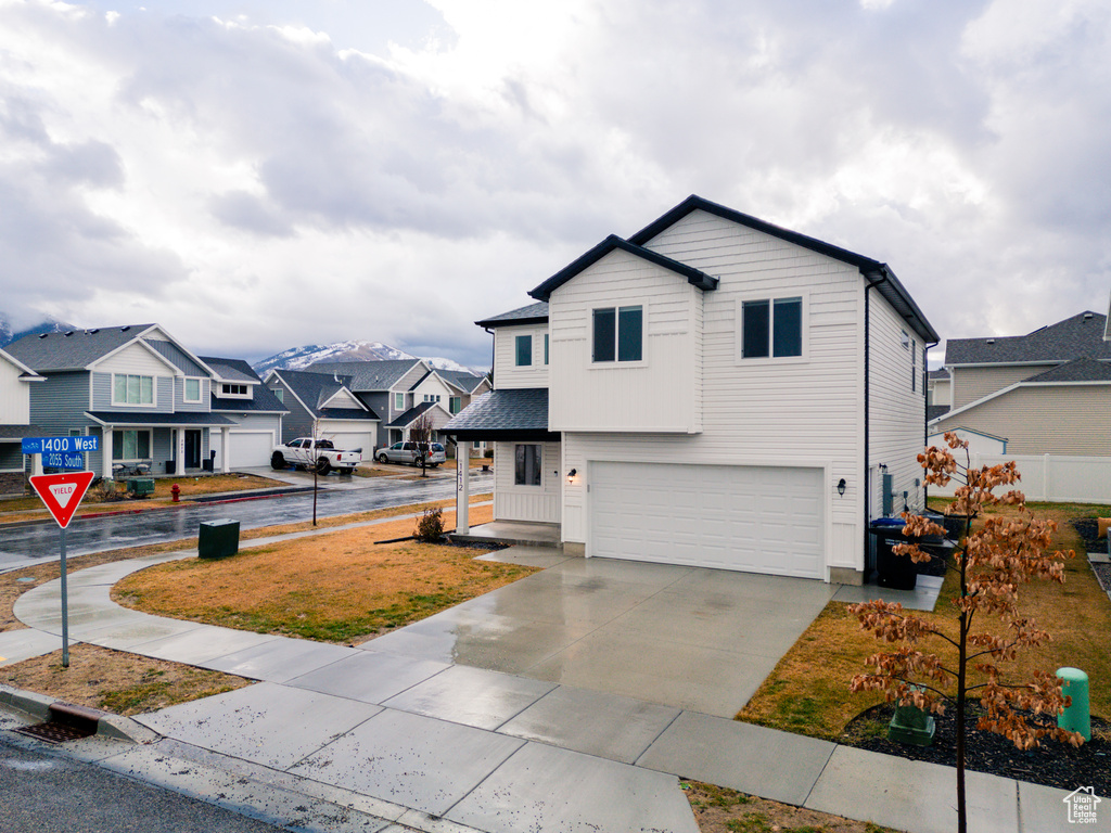 View of property featuring a garage