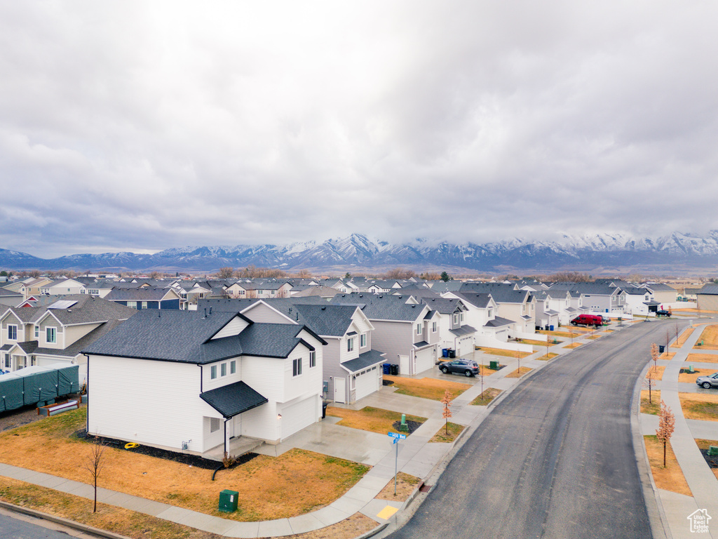 Birds eye view of property with a mountain view