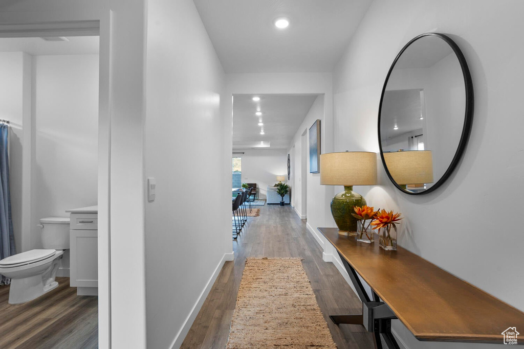 Corridor featuring dark hardwood / wood-style floors