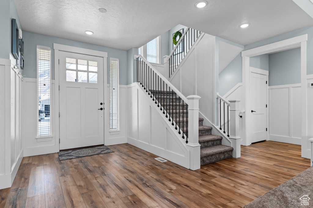 Foyer with hardwood / wood-style floors