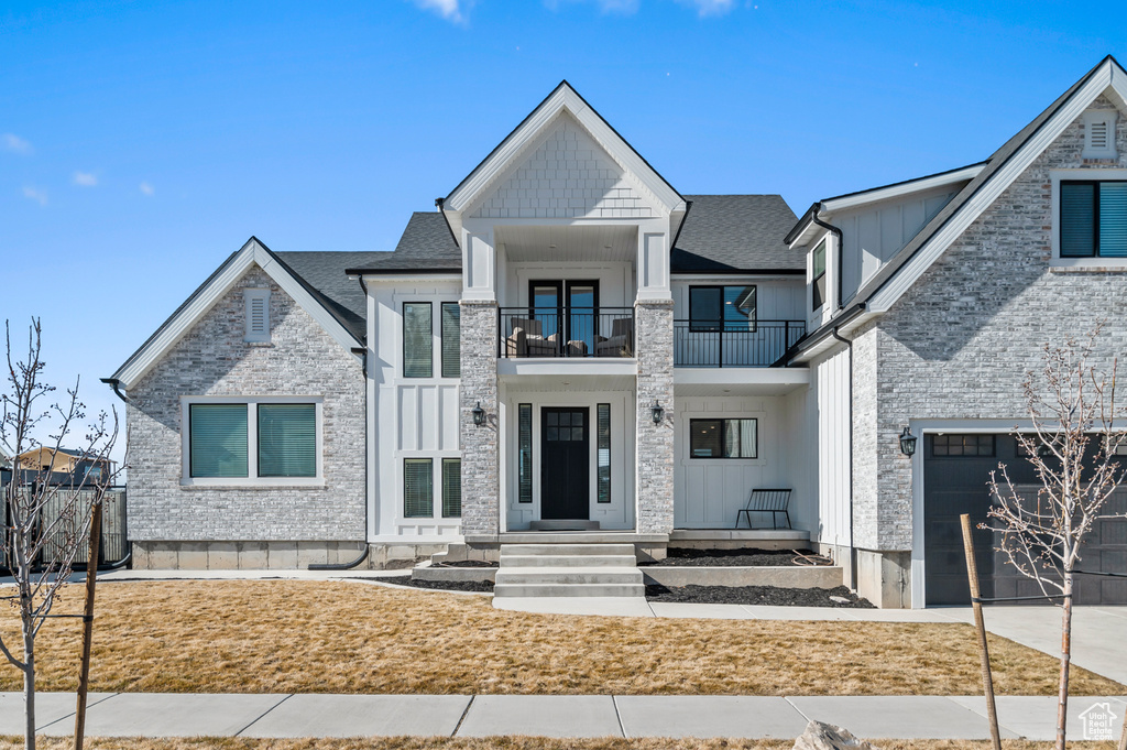 View of front of home with a balcony