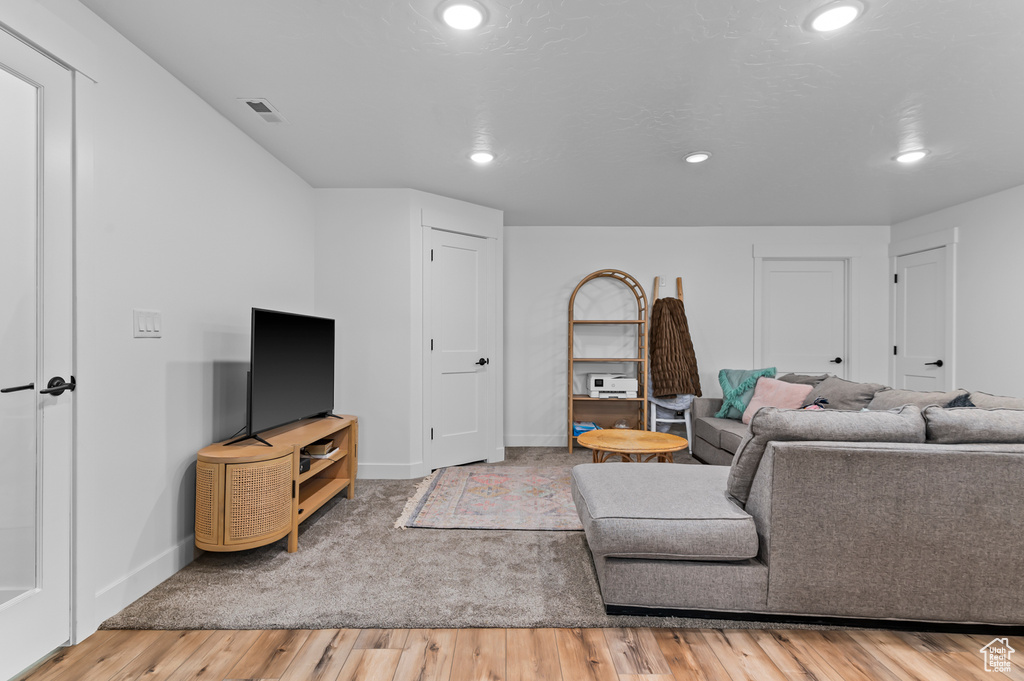 Living room with wood-type flooring