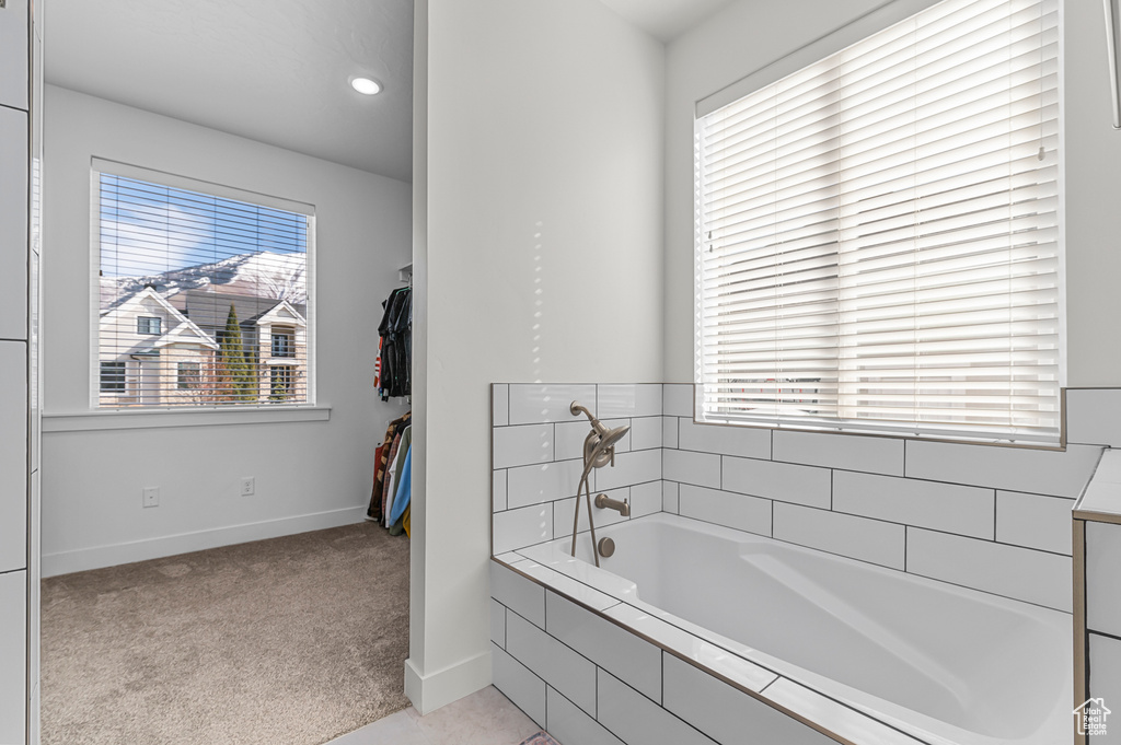 Bathroom with tiled tub