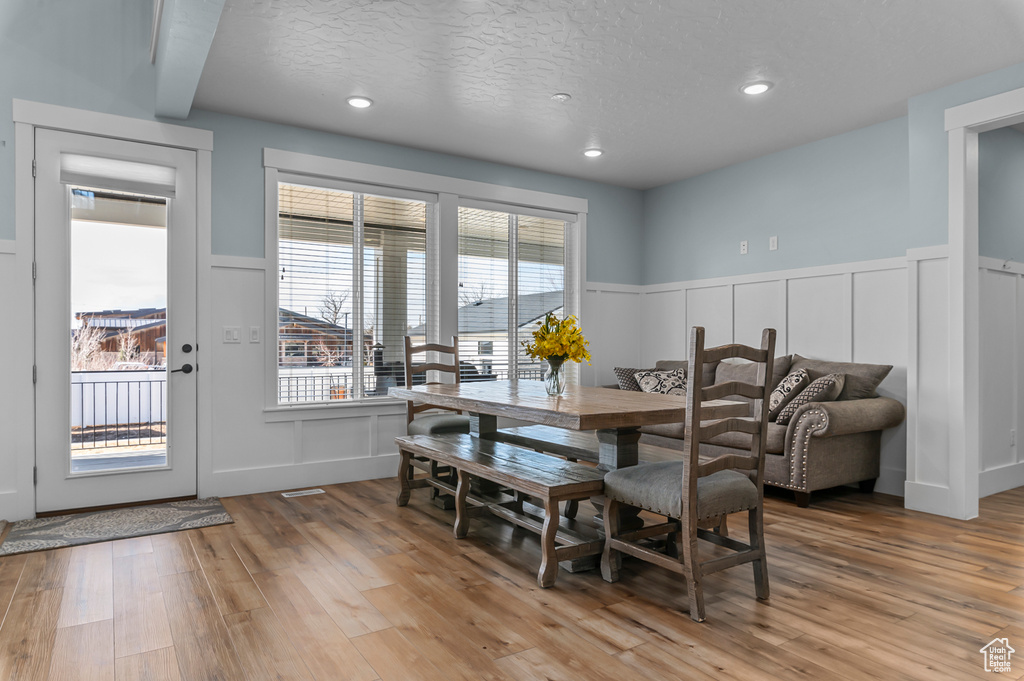 Dining room featuring a textured ceiling and light wood-type flooring