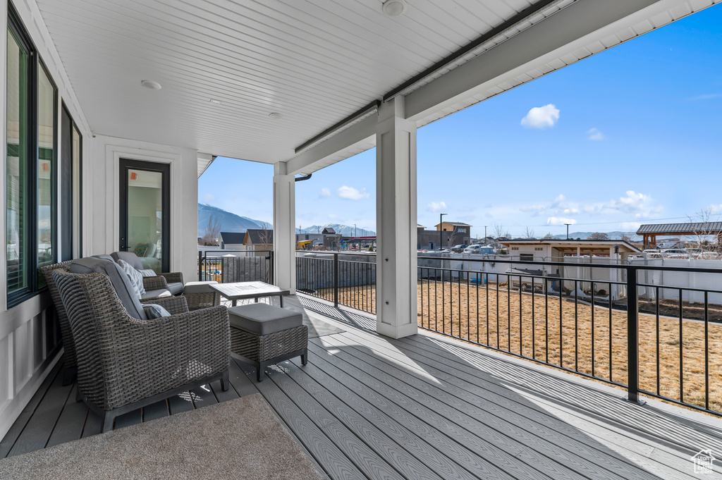 Wooden terrace featuring a mountain view