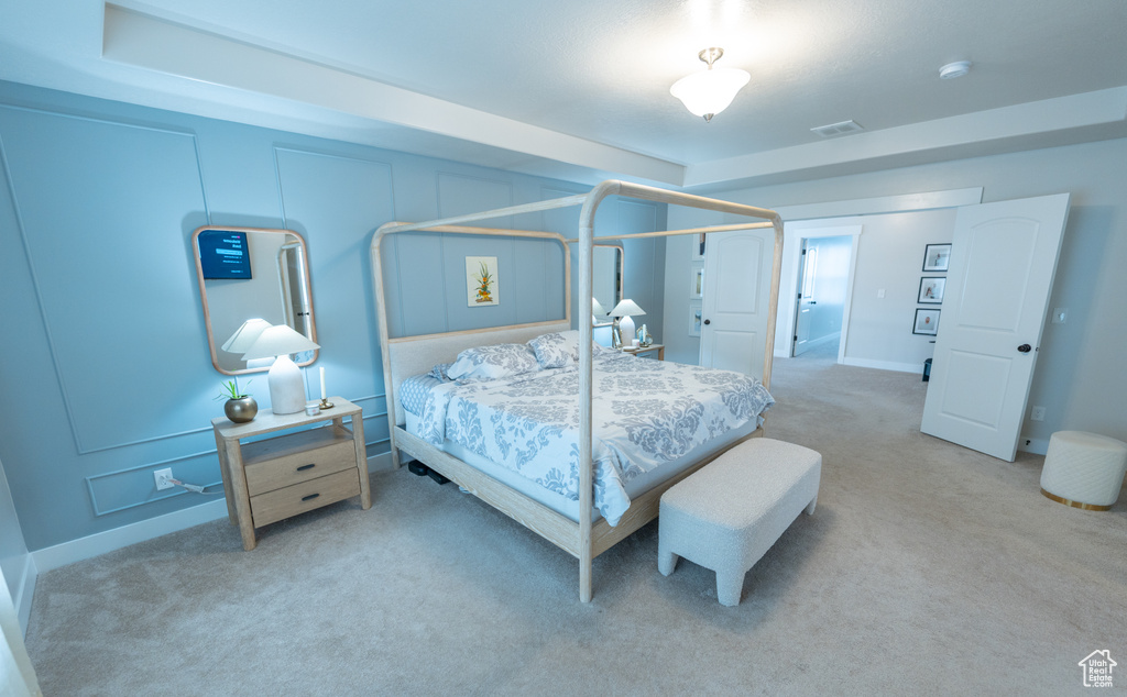 Carpeted bedroom featuring baseboards