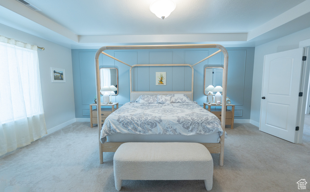 Carpeted bedroom featuring baseboards