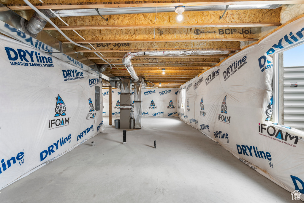 Basement featuring heating unit