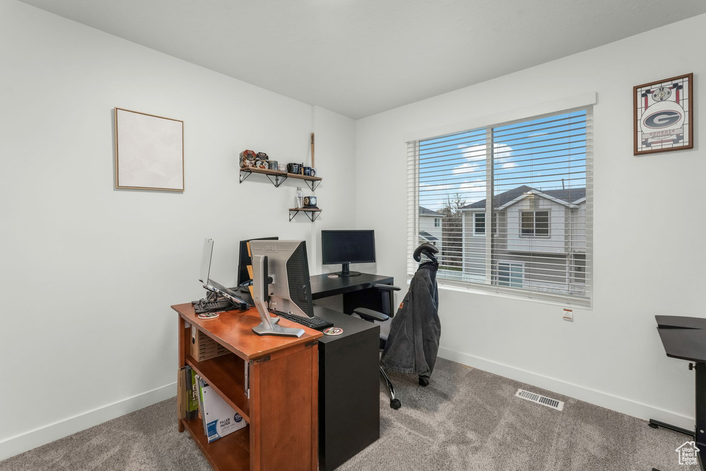 Home office featuring carpet flooring