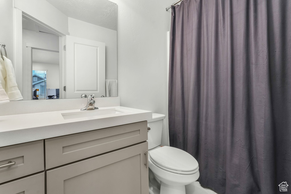 Bathroom with vanity and toilet