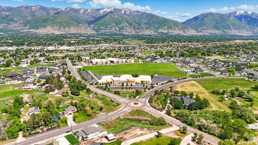 View of property location featuring a mountainous background and nearby suburban area