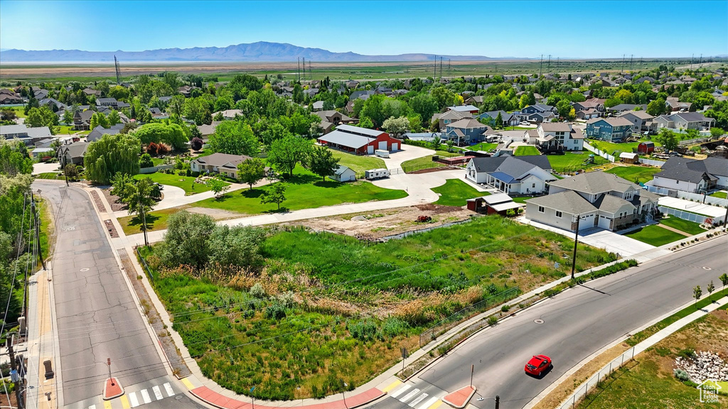 Aerial view of residential area with a mountain backdrop
