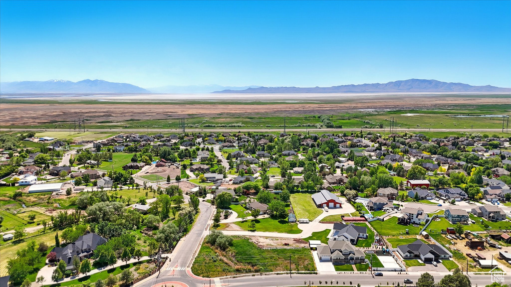 Aerial view of residential area featuring a mountain backdrop