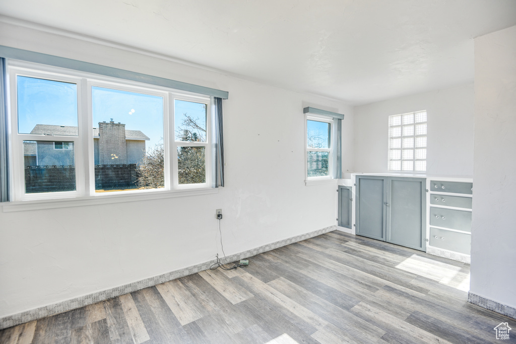 Unfurnished room with light wood-type flooring