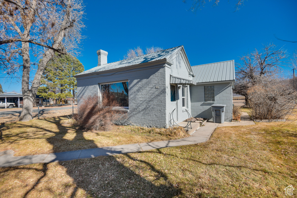 View of home's exterior featuring a yard