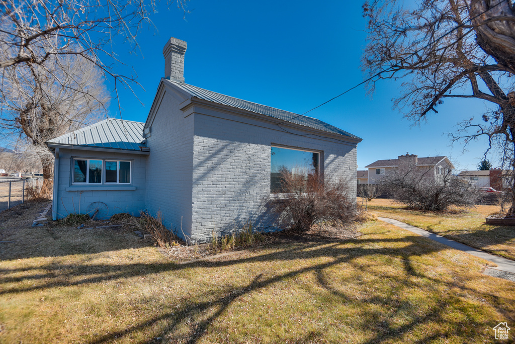 View of home's exterior featuring a yard