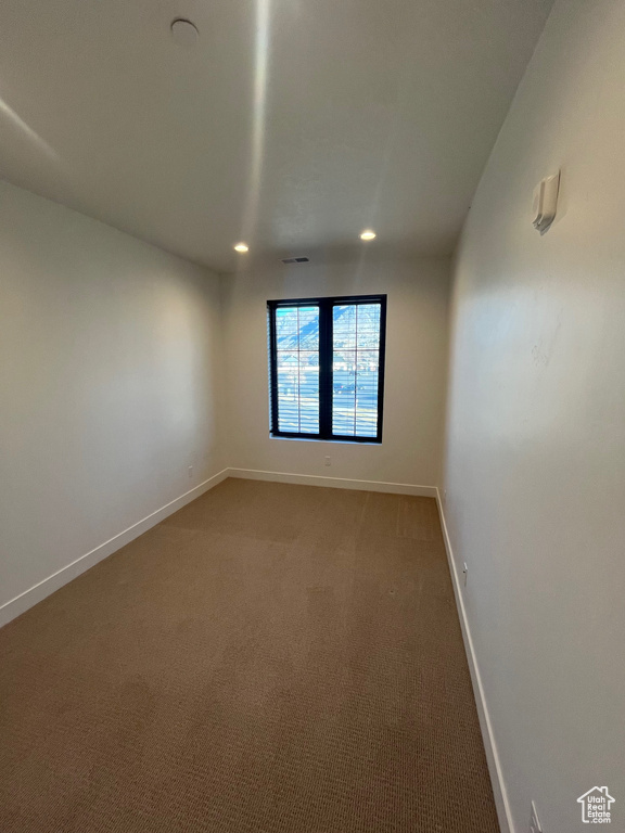 Unfurnished room with carpet floors