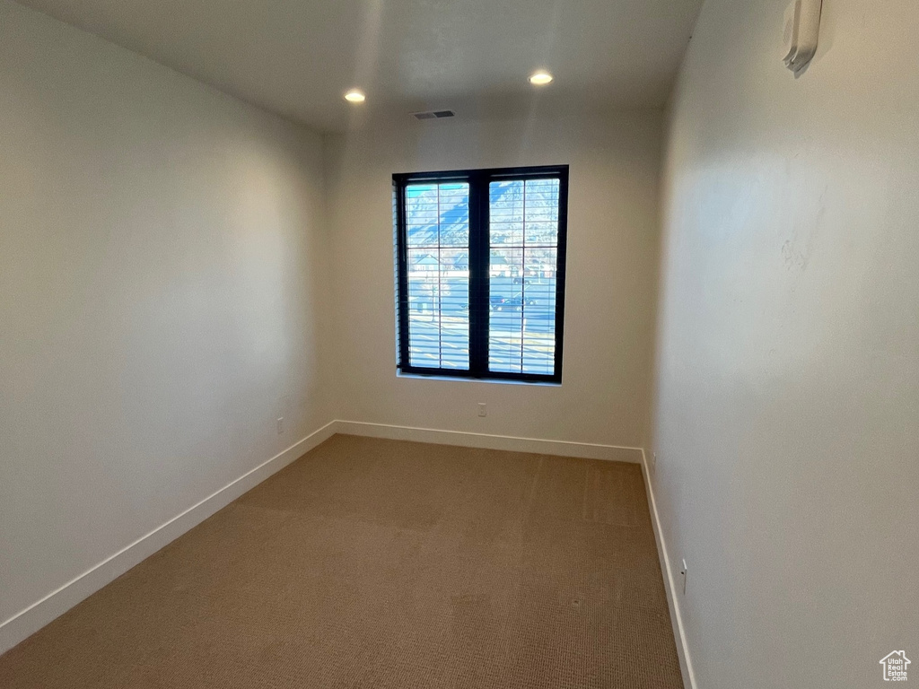 View of carpeted spare room