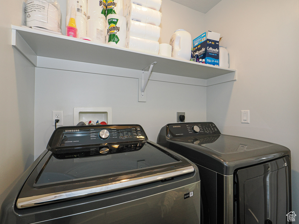 Laundry room featuring separate washer and dryer